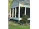 Sunroom addition with large windows and green landscaping at 939 Beecher Sw Ct, Atlanta, GA 30311