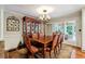 Elegant dining room with hardwood floors and access to sunroom at 3992 Doc Sams Rd, Cumming, GA 30028