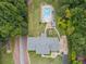 Aerial view showcasing the home's layout, pool, and landscaping at 3992 Doc Sams Rd, Cumming, GA 30028