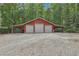 Triple-car garage with covered parking and gravel area at 3992 Doc Sams Rd, Cumming, GA 30028