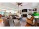 Open-concept living room with a view into the kitchen at 3992 Doc Sams Rd, Cumming, GA 30028