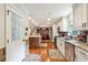 Updated kitchen with granite countertops, stainless steel appliances, and brick accents at 3992 Doc Sams Rd, Cumming, GA 30028