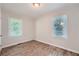 Spacious bedroom with wood-look floors and large window at 2666 Blount St, Atlanta, GA 30344