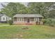 Charming one-story home with stone accents and a well-maintained lawn at 2666 Blount St, Atlanta, GA 30344