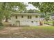 Rear view of a single-story house with a large yard at 2666 Blount St, Atlanta, GA 30344