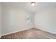 Bright bedroom with wood-look floors and large window at 2666 Blount St, Atlanta, GA 30344