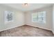 Spacious bedroom with wood-look floors and two windows at 2666 Blount St, Atlanta, GA 30344