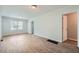 Bright living room featuring wood-look flooring and updated light fixtures at 2666 Blount St, Atlanta, GA 30344