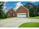 Brick home with attached garage and long driveway at 37 Red Fox Trl, Euharlee, GA 30145