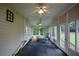 Relaxing sunroom with rocking chair and ample natural light at 37 Red Fox Trl, Euharlee, GA 30145