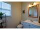 Clean bathroom with white vanity, toilet, and framed mirror at 37 Red Fox Trl, Euharlee, GA 30145
