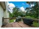 Wooden deck with built-in grill and wooded backyard views at 37 Red Fox Trl, Euharlee, GA 30145