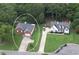 Two houses; one brick, one white, both with attached garages and large yards at 37 Red Fox Trl, Euharlee, GA 30145