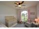Charming Bedroom with a crib, rocking chair, and large window at 37 Red Fox Trl, Euharlee, GA 30145