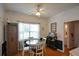 Charming dining area with round table and chairs, hardwood floors, and access to sunroom at 37 Red Fox Trl, Euharlee, GA 30145