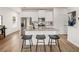 Modern kitchen with white cabinets, granite island, and stainless steel appliances at 204 Epping Street # 2, Stockbridge, GA 30281