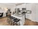 White kitchen with granite island and stainless steel appliances at 204 Epping Street # 2, Stockbridge, GA 30281