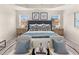 Spacious main bedroom with plush bed and sitting area at 204 Epping Street # 2, Stockbridge, GA 30281