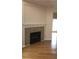 Living room with corner fireplace and hardwood floors at 585 Mcwilliams Se Rd # 2307, Atlanta, GA 30315