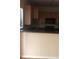 Kitchen with wood cabinets and black countertop at 585 Mcwilliams Se Rd # 2307, Atlanta, GA 30315
