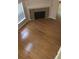 High-ceilinged living room with hardwood floors and corner fireplace at 585 Mcwilliams Se Rd # 2307, Atlanta, GA 30315