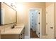 Bathroom with vanity, quartz countertop, and a walk-in shower at 1875 Highway 142, Covington, GA 30014