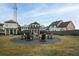 Community fire pit with seating in grassy area at 52 Spirea Way, Auburn, GA 30011