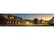 Evening view of charming community street with various houses at 52 Spirea Way, Auburn, GA 30011