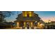 Evening view of charming community clubhouse with inviting outdoor seating area at 52 Spirea Way, Auburn, GA 30011