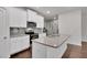 White kitchen with granite countertops and stainless steel appliances at 5586 Cannonade Ln, Stonecrest, GA 30058