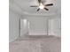 Spacious bedroom with ceiling fan and access to other rooms at 5586 Cannonade Ln, Stonecrest, GA 30058