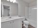 Clean bathroom with a shower/tub combo, toilet and vanity at 5586 Cannonade Ln, Stonecrest, GA 30058