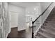 Hallway with dark hardwood floors and stairs to upper level at 5586 Cannonade Ln, Stonecrest, GA 30058