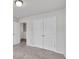 Spacious bedroom with double doors to closet and carpet flooring at 5586 Cannonade Ln, Stonecrest, GA 30058