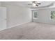Spacious bedroom with ceiling fan and plush carpeting at 5586 Cannonade Ln, Stonecrest, GA 30058