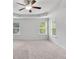 Bright bedroom featuring a ceiling fan and neutral walls at 5586 Cannonade Ln, Stonecrest, GA 30058