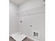 Laundry room with built in shelving and drain at 5586 Cannonade Ln, Stonecrest, GA 30058