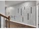 Modern hallway with dark hardwood floors and an accent wall at 5586 Cannonade Ln, Stonecrest, GA 30058