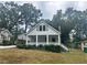 White house with front porch and landscaping at 2203 Hillcrest Ave, Decatur, GA 30032