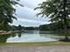 Serene lake view with lush greenery and a paved walkway at 2203 Hillcrest Ave, Decatur, GA 30032