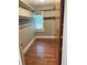 Walk-in closet with hardwood floors and shelving at 2203 Hillcrest Ave, Decatur, GA 30032
