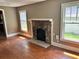 Living room with hardwood floors and stone fireplace at 2203 Hillcrest Ave, Decatur, GA 30032