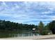 Peaceful lake view with a gazebo and tree-lined shore at 2203 Hillcrest Ave, Decatur, GA 30032