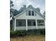 White house with front porch and landscaping at 2203 Hillcrest Ave, Decatur, GA 30032