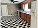 Checkerboard floor kitchen with wood cabinets and appliances at 2203 Hillcrest Ave, Decatur, GA 30032