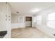 Kitchen with white cabinets, tile floor, and laundry closet at 2466 Country Club Dr, Conyers, GA 30013