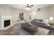 Living room with hardwood floors, fireplace, and staged furniture at 320 Pintail Ct, Suwanee, GA 30024