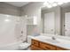 Bathroom with shower/tub combo, vanity, and built-in shelving at 320 Pintail Ct, Suwanee, GA 30024