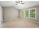 Large bedroom with vaulted ceiling and three windows at 320 Pintail Ct, Suwanee, GA 30024