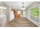 Eat in kitchen with wood cabinets and view to backyard at 320 Pintail Ct, Suwanee, GA 30024